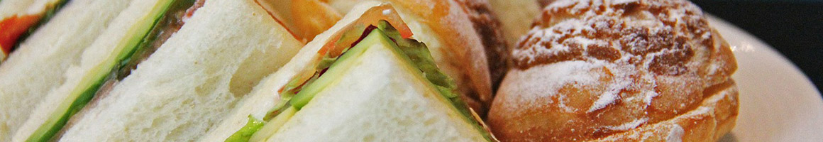 Eating Sandwich Cheesesteak at DiBlasis Subs restaurant in Everett, MA.